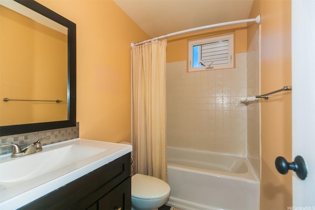 bathroom with toilet, shower / bath combo, backsplash, and vanity