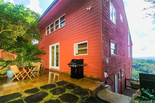 view of side of property featuring a patio area