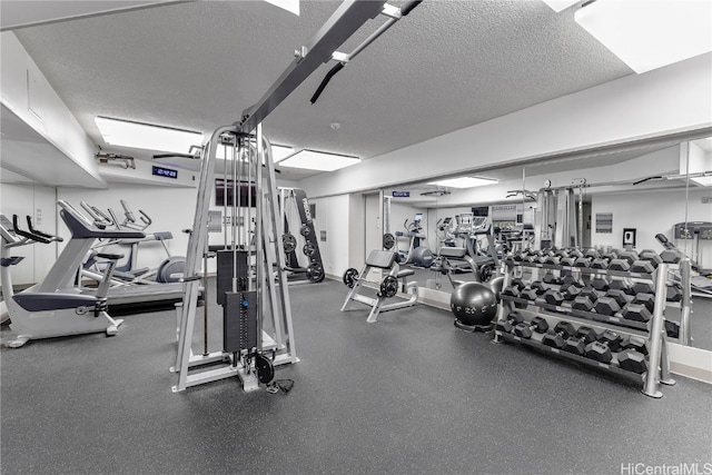 workout area with a textured ceiling