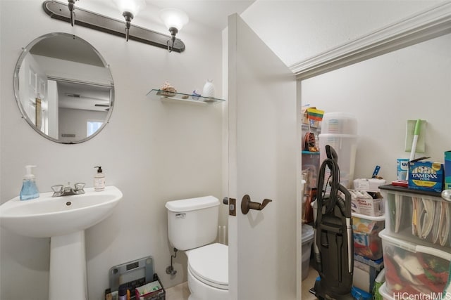 bathroom featuring toilet and sink