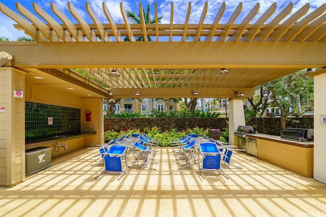 view of patio / terrace with a pergola, grilling area, and sink