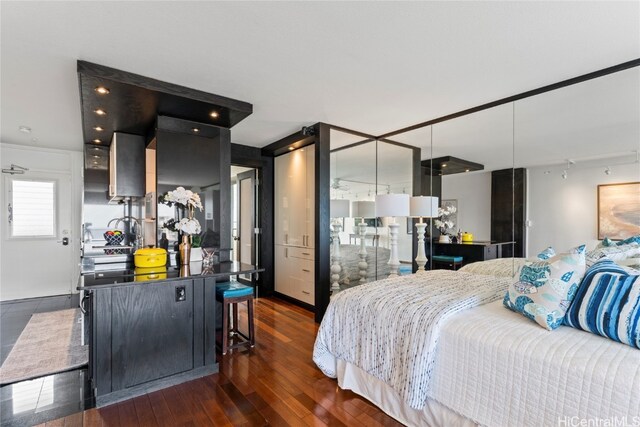 bedroom featuring dark wood-type flooring