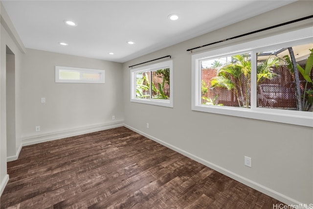 unfurnished room featuring dark hardwood / wood-style floors