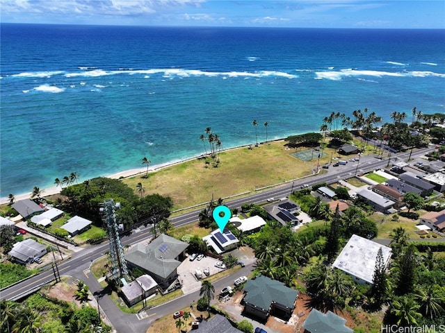 bird's eye view with a water view and a view of the beach