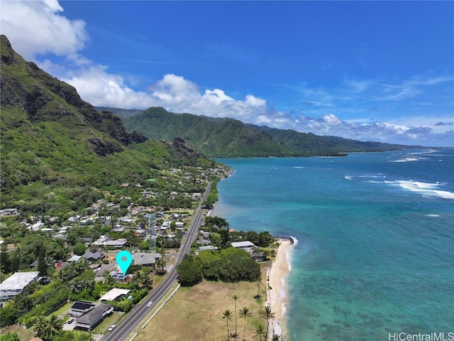 birds eye view of property with a water and mountain view