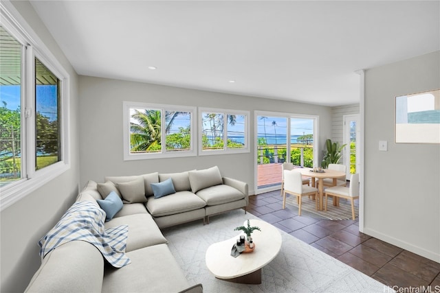 tiled living room with a healthy amount of sunlight