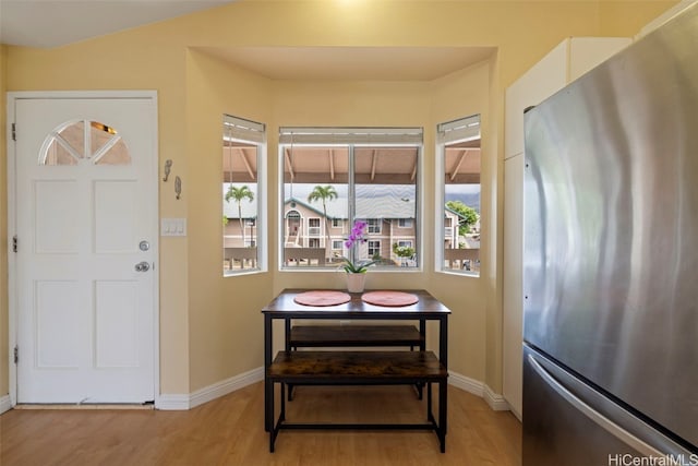 dining room with light hardwood / wood-style floors