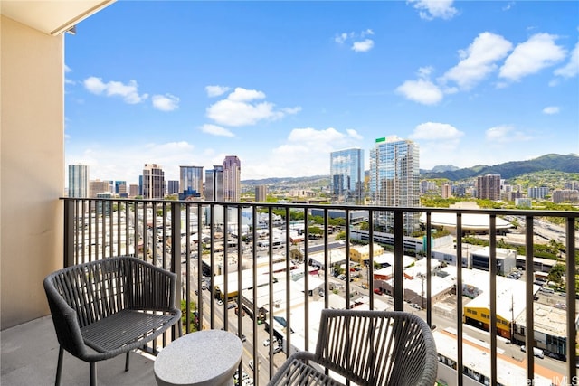 balcony featuring a mountain view