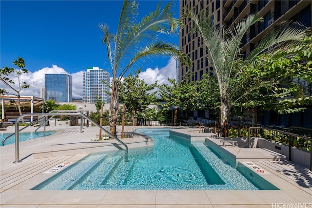 view of pool featuring a patio area