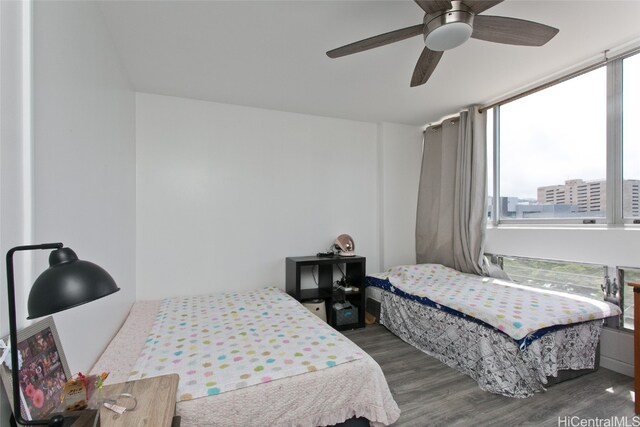 bedroom featuring dark hardwood / wood-style floors and ceiling fan