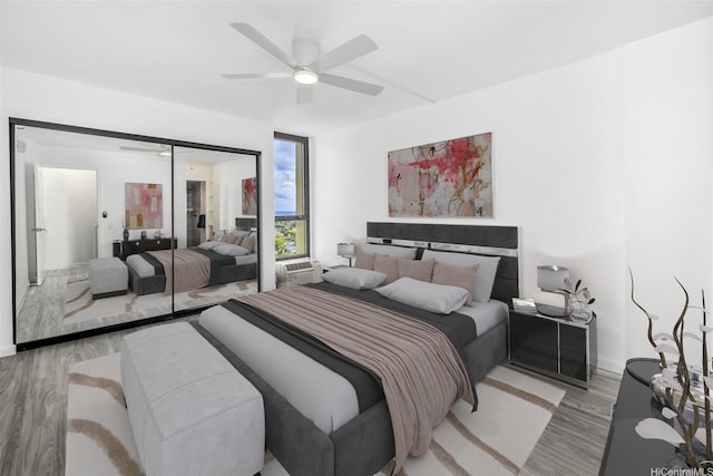 322 Aoloa St Unit Ph-9, Kailua, HI 96734 - bedroom with light wood-type flooring, baseboards, ceiling fan, and a closet