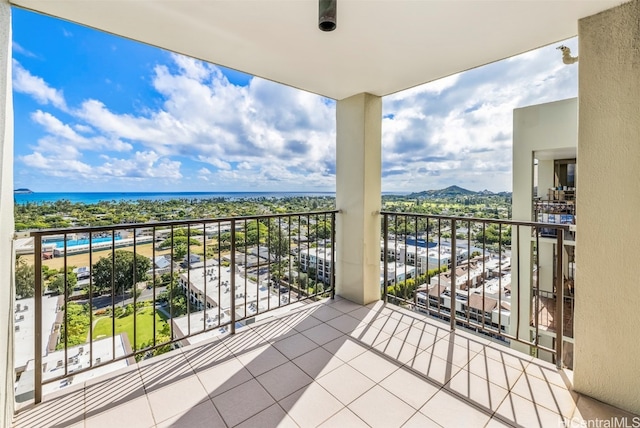 balcony featuring a water view