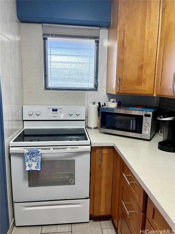 kitchen with backsplash and electric stove