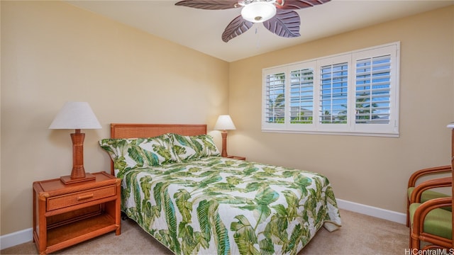 bedroom featuring light carpet and ceiling fan