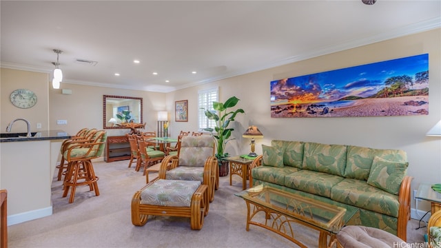 carpeted living room featuring sink and crown molding