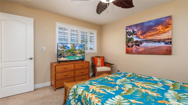 bedroom with light colored carpet and ceiling fan