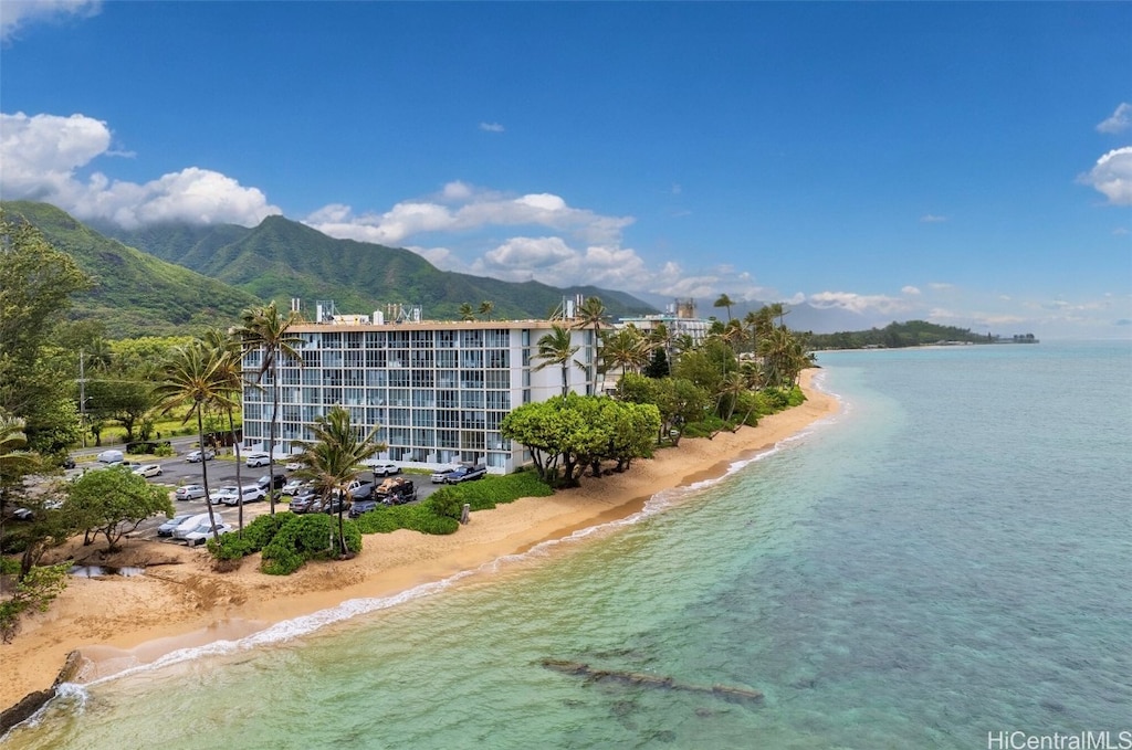 bird's eye view featuring a water and mountain view and a view of the beach