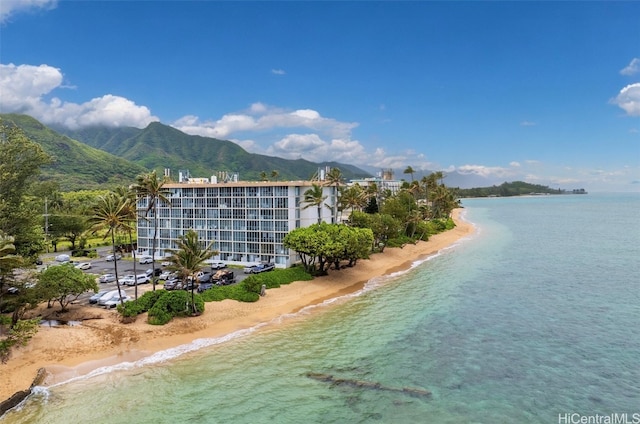 bird's eye view featuring a water and mountain view and a view of the beach