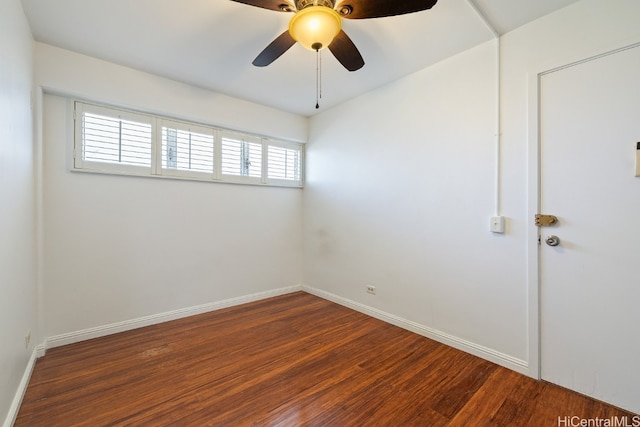 empty room with dark wood-type flooring, ceiling fan, and plenty of natural light