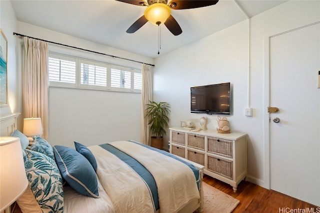 bedroom featuring dark hardwood / wood-style flooring and ceiling fan