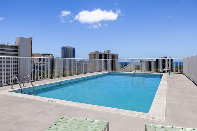 view of swimming pool with a patio