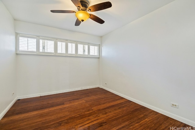 empty room featuring dark hardwood / wood-style floors and ceiling fan