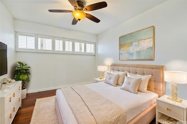 bedroom featuring ceiling fan and dark hardwood / wood-style floors