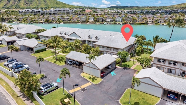 birds eye view of property with a water view