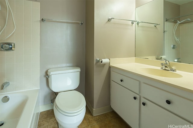 full bathroom with toilet, tiled shower / bath combo, vanity, and tile patterned flooring