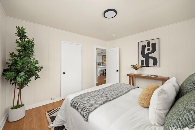 bedroom with wood finished floors