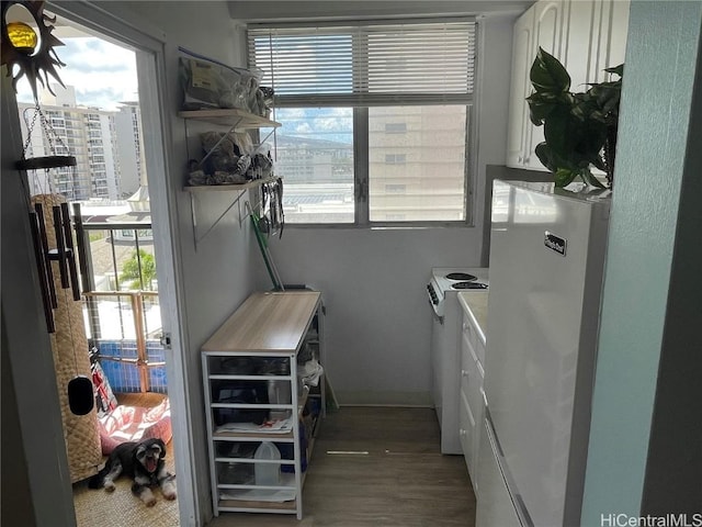 interior space featuring dark hardwood / wood-style floors and washer / clothes dryer