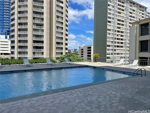 view of swimming pool featuring a patio area