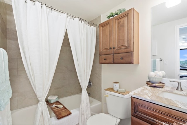 full bathroom with vanity, shower / bath combination with curtain, and toilet