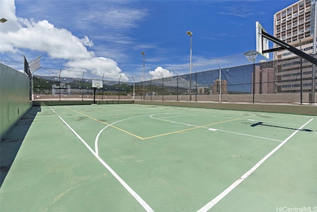 view of sport court with a mountain view