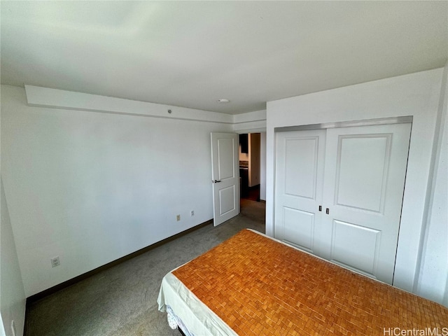 unfurnished bedroom with carpet floors and a closet