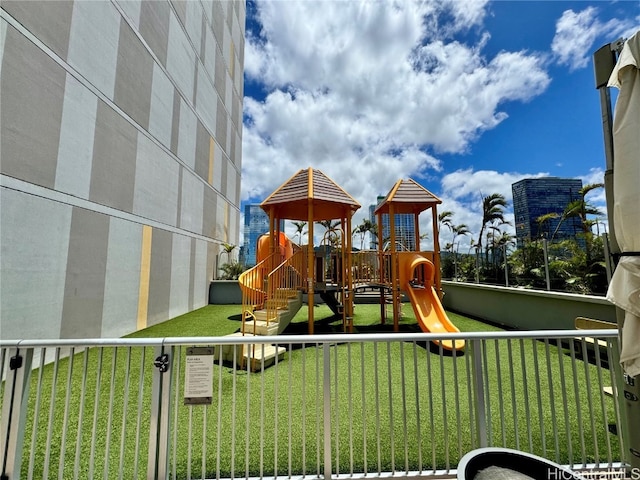 view of playground with a yard