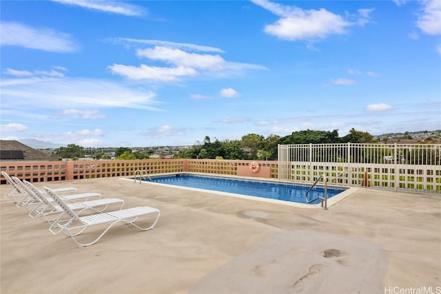 view of swimming pool featuring a patio area