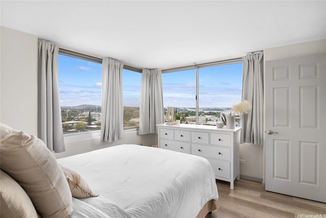 bedroom featuring light wood-style flooring