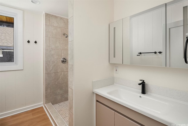 2315 California Ave Unit B, Wahiawa, HI 96786 - bathroom with vanity, baseboards, tiled shower, and wood finished floors