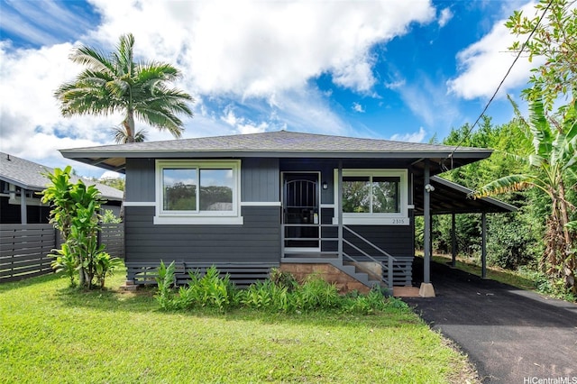 2315 California Ave Unit B, Wahiawa, HI 96786 - bungalow with roof with shingles, a front lawn, entry steps, and aphalt driveway