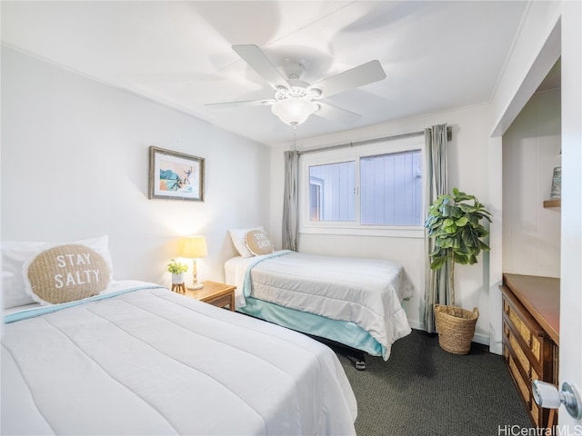 bedroom featuring ornamental molding, carpet flooring, and ceiling fan