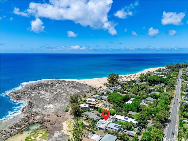 bird's eye view with a water view and a view of the beach