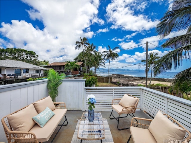 view of patio with a water view and outdoor lounge area