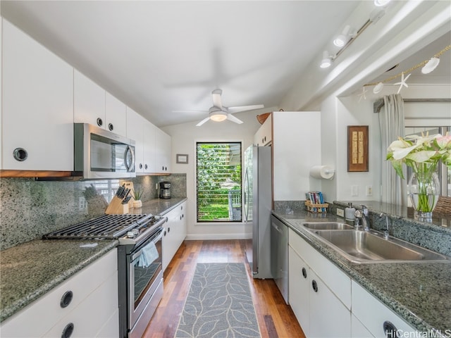 kitchen featuring white cabinetry, appliances with stainless steel finishes, sink, and dark hardwood / wood-style flooring