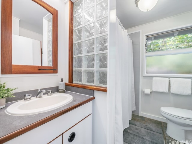 bathroom with vanity, toilet, tile patterned floors, and a shower with shower curtain