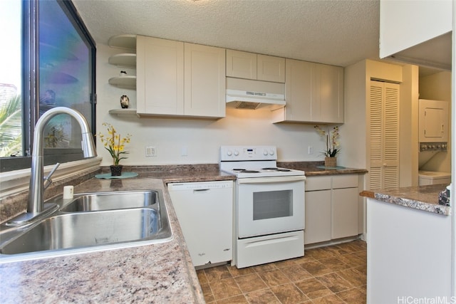 kitchen with white cabinetry, white appliances, sink, and a textured ceiling