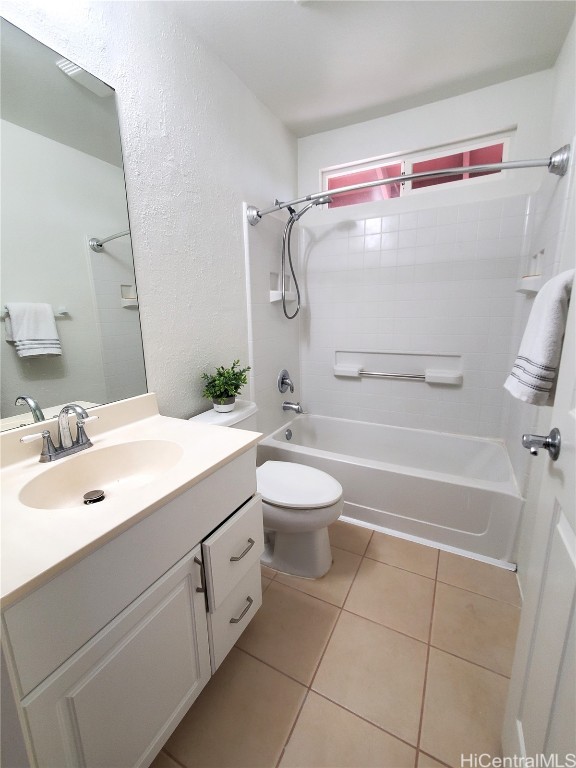 full bathroom featuring toilet, bathtub / shower combination, vanity, and tile patterned flooring