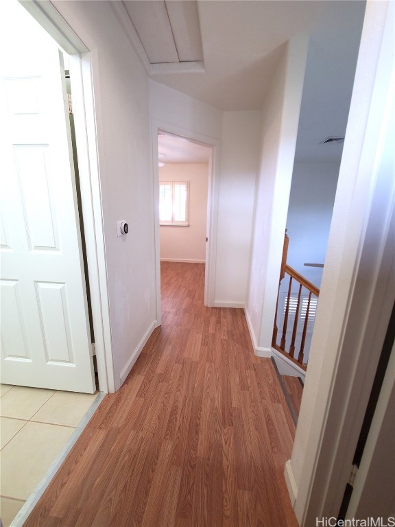 corridor featuring hardwood / wood-style floors