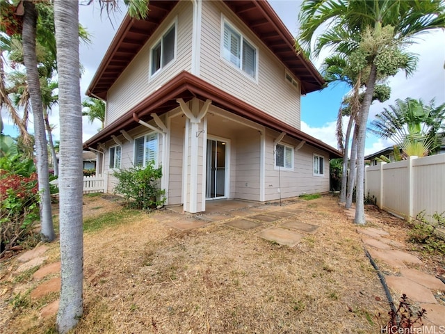 rear view of property featuring a patio area