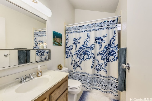 bathroom with a shower with curtain, lofted ceiling, toilet, and vanity